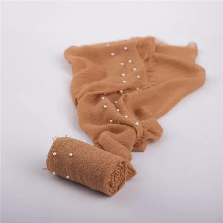 لفة قماش قطن باطراف من اللولو لتصوير المواليد